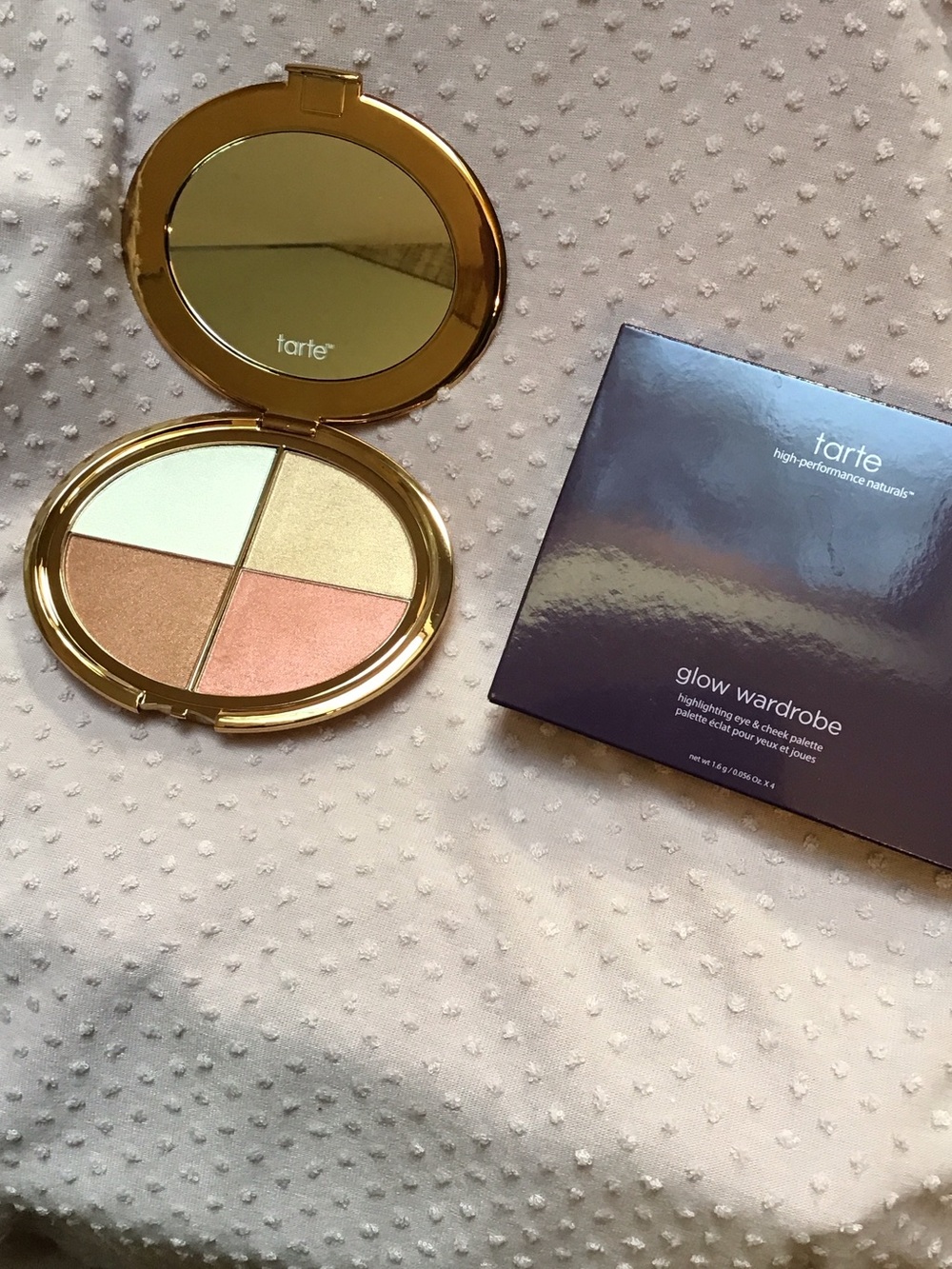TARTE highlighter palette. Sheer shades of white, gold, pink and bronze.